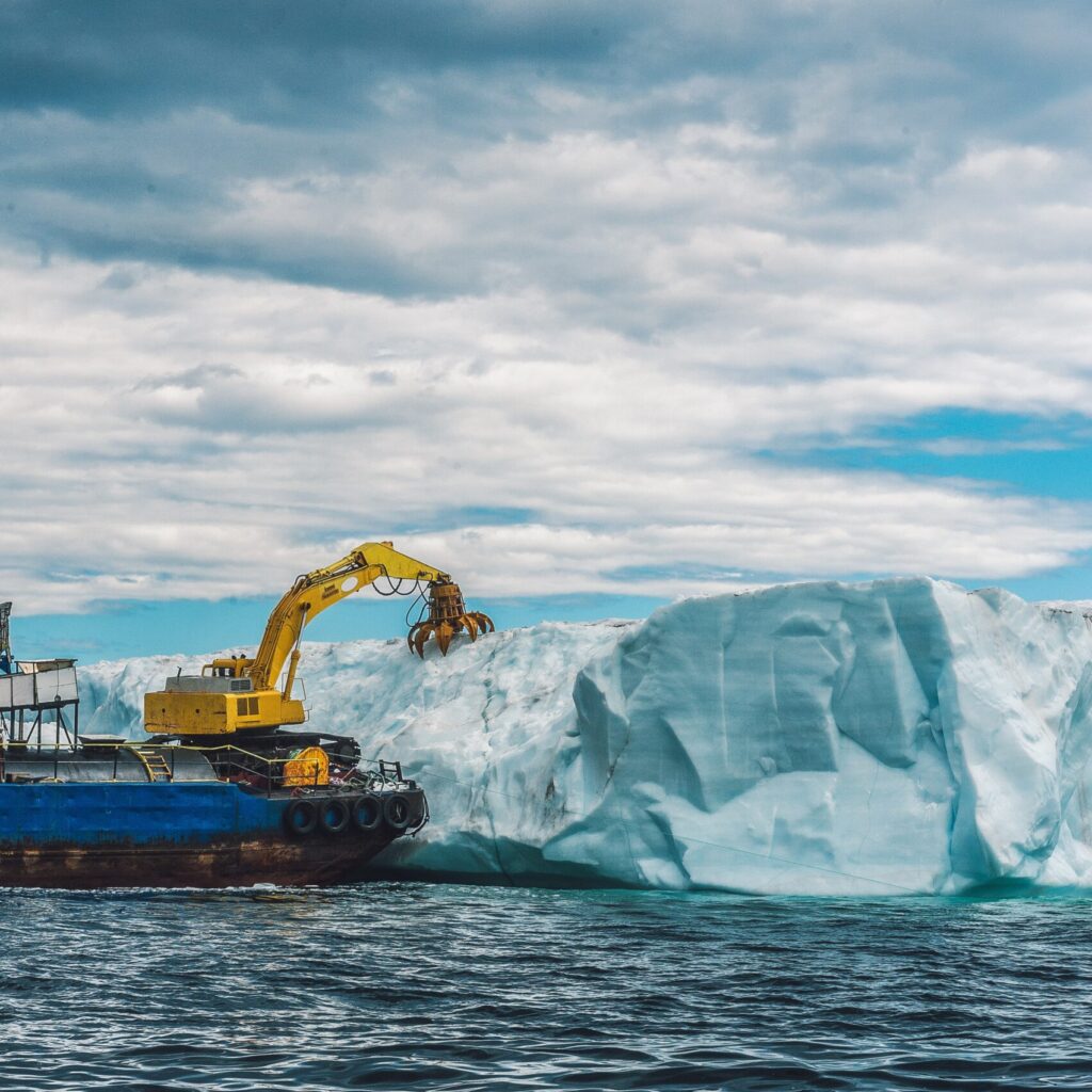 heavy machinery boat near iceberg